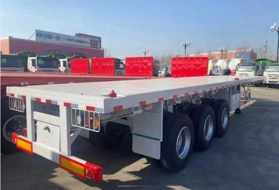 Q345b メインビーム3軸 20ft 40ft コンテナ輸送 60-100トンのフラットベッドフラットベッドトラックセミトレーラー