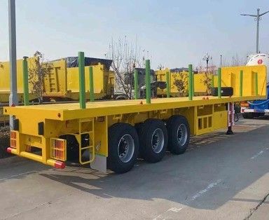 Q345b メインビーム3軸 20ft 40ft コンテナ輸送 60-100トンのフラットベッドフラットベッドトラックセミトレーラー